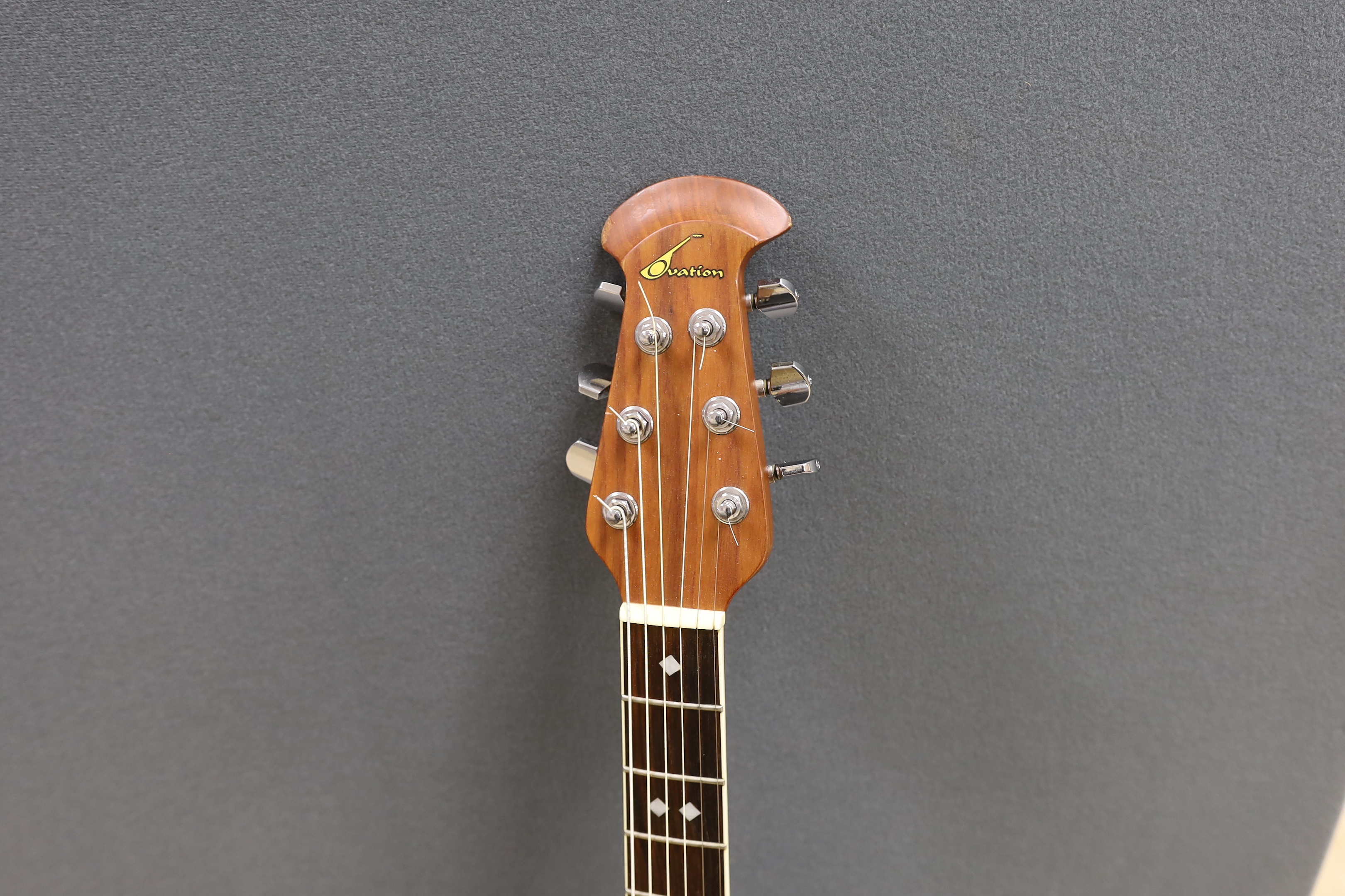A Celebrity by Ovation electro-acoustic round back guitar with hard case